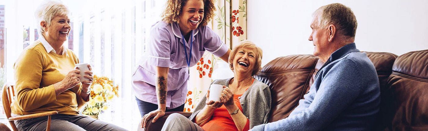 Older couple relaxing at home with family